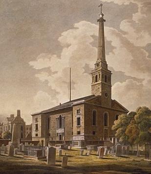 Historic church with a tall steeple surrounded by gravestones and trees under a cloudy sky.